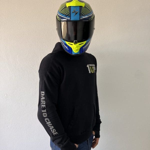 Side profile of a Second 1UP black motorcycle hoodie, featuring 'Dare to Chase' text, styled for motorsports riders