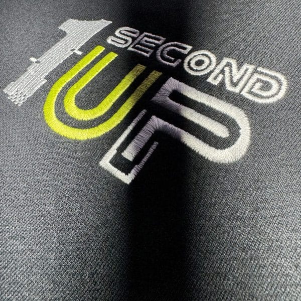 Logo detail of Second 1UP black motorcycle hoodie with a large logo
