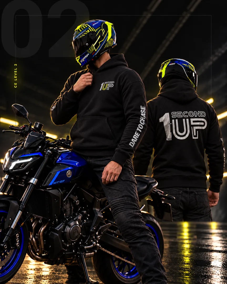 Two motorcycle riders wearing 1SecondUP armoured hoodies on a steel bridge